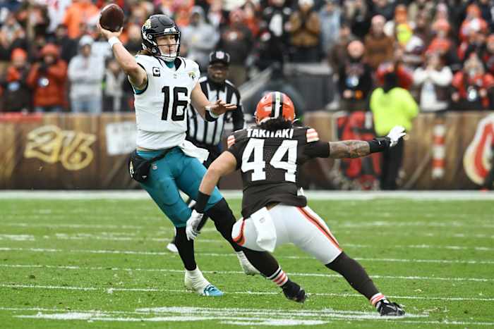 Dec 10, 2023; Cleveland, Ohio, USA; Jacksonville Jaguars quarterback Trevor Lawrence (16) throws a pass over Cleveland Browns linebacker Sione Takitaki (44) during the first half at Cleveland Browns Stadium.